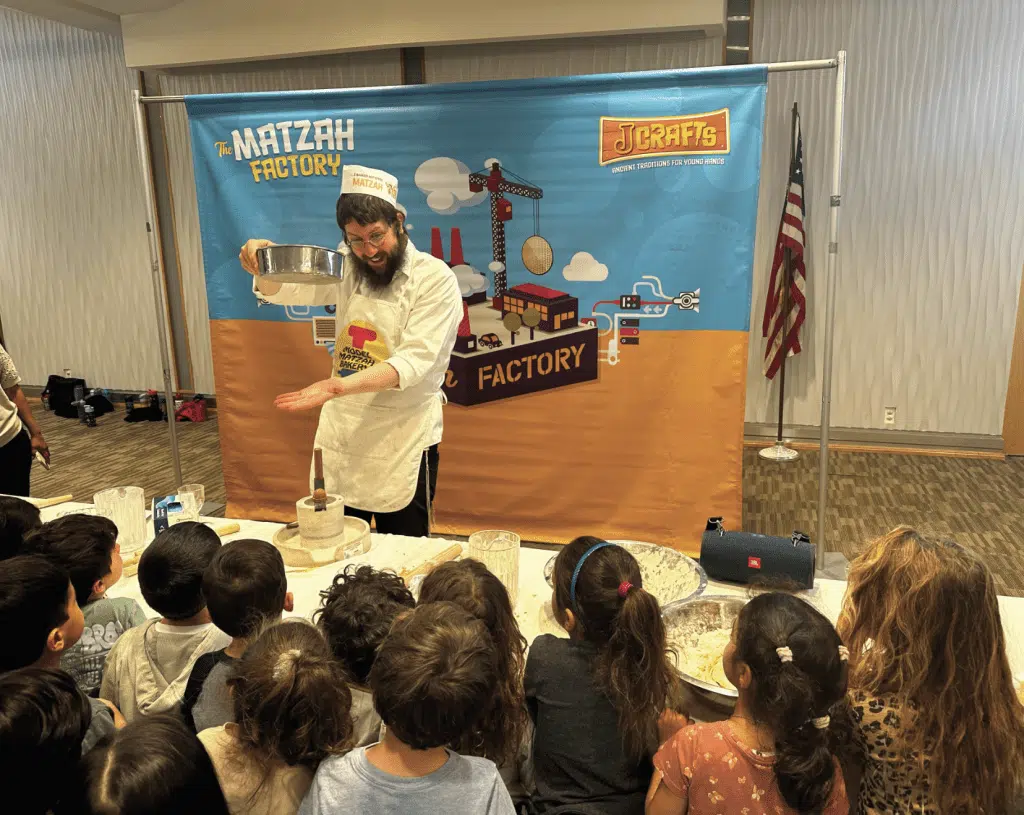 kids watching a demonstration at Temple Isaiah's preschool